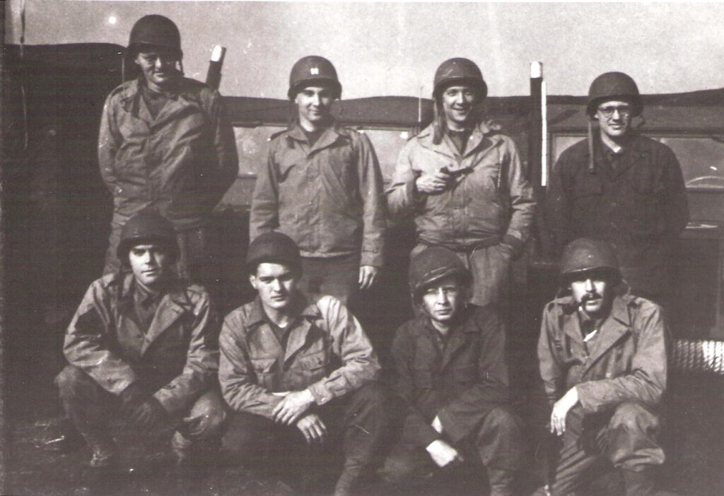 The crew that came across Omaha Beach on D plus 5 and published the Beachhead Bulletin Front row Charles Kiley Walter Newfield James Grainey Leonard Ruder Second row Francis Jackson William McNamara Jacob Miller Peter Hansson