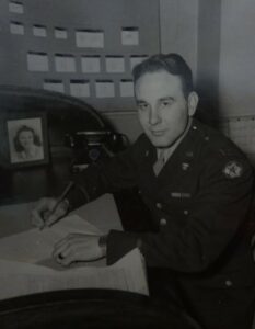 Bill McNamara working in the Stars and Stripes newsroom in Paris during World War 2