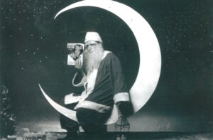 George Roberts dressed as a tired Santa Claus in a popular ad which was displayed in train stations in Japan in the 1960s