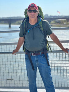 man standing in front of body of water